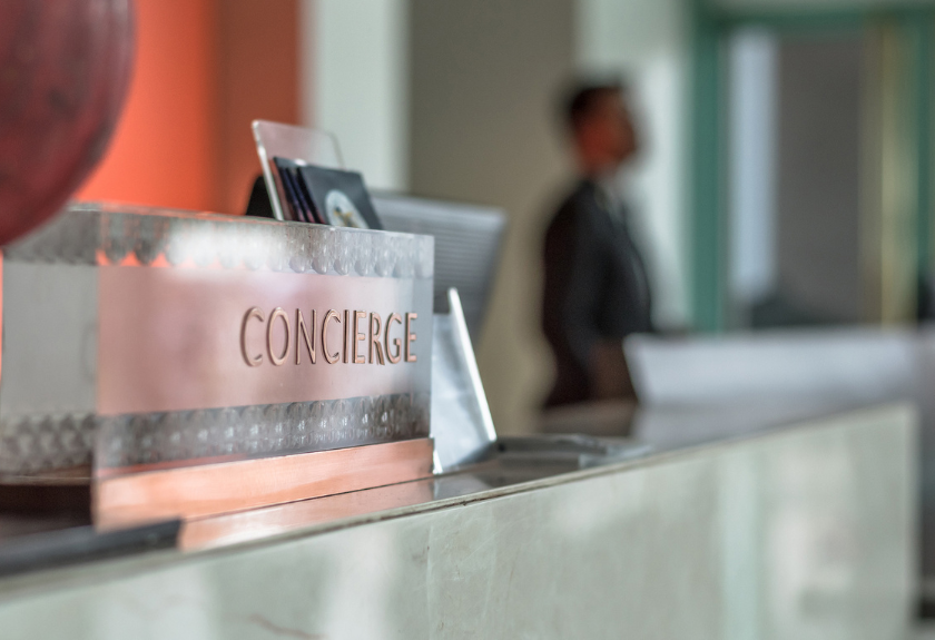 concierge sign at the main entrance of a condominium building