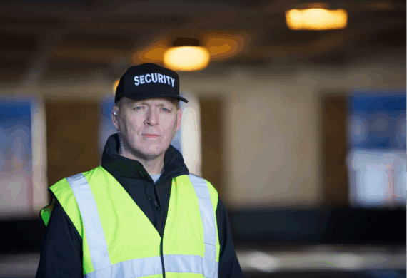 security guard in safety vest doing an outside patrol