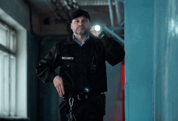 security guard with flash light on a patrol