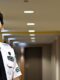 male iron horse security guard in concierge uniform in the hallway of a residence building