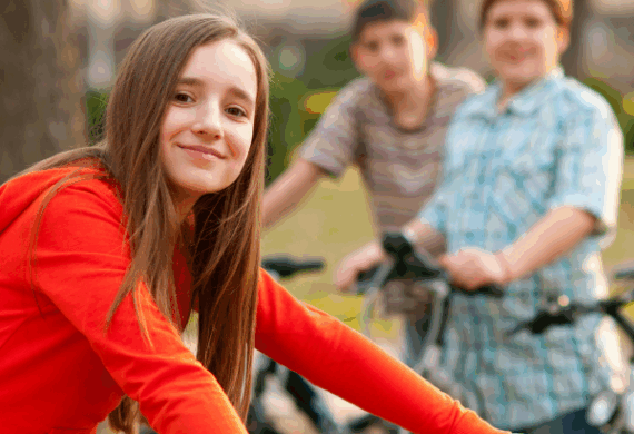 Bub and birdie - preteens smiling as they pause on a bike ride